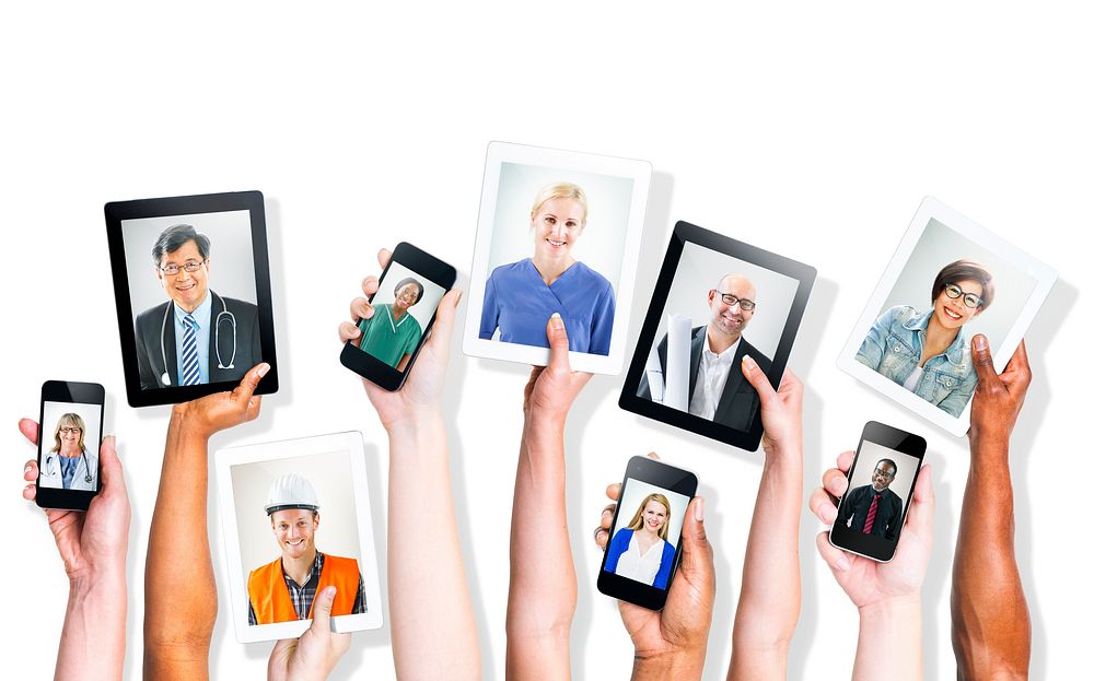 Hands Holding Digital Devices with Professional People's Images