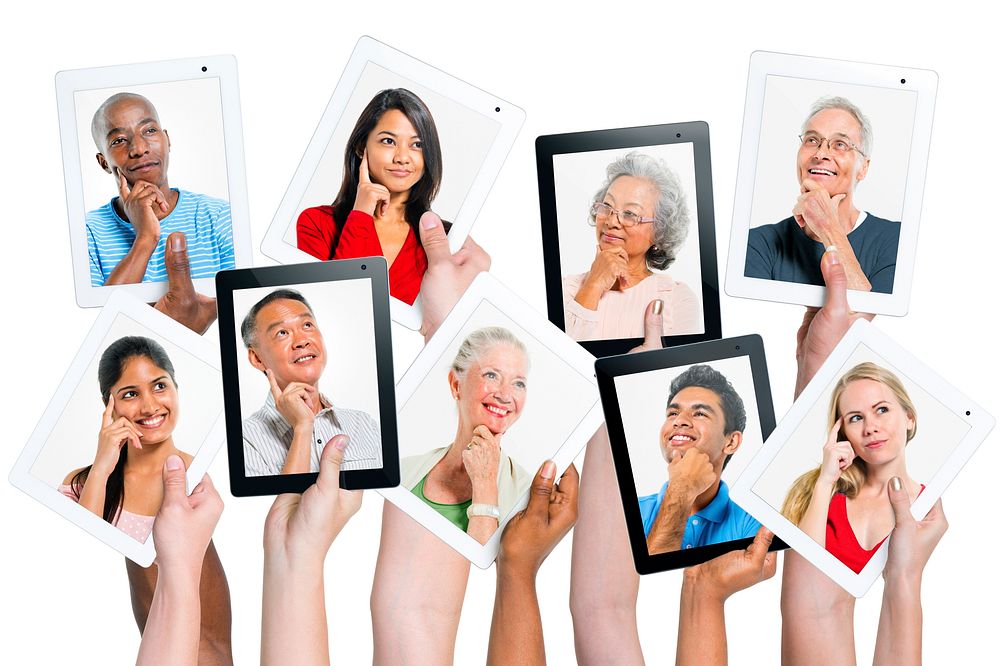 Variation of hands holding digital tablets with multi ethnic people thinking of inspiration.