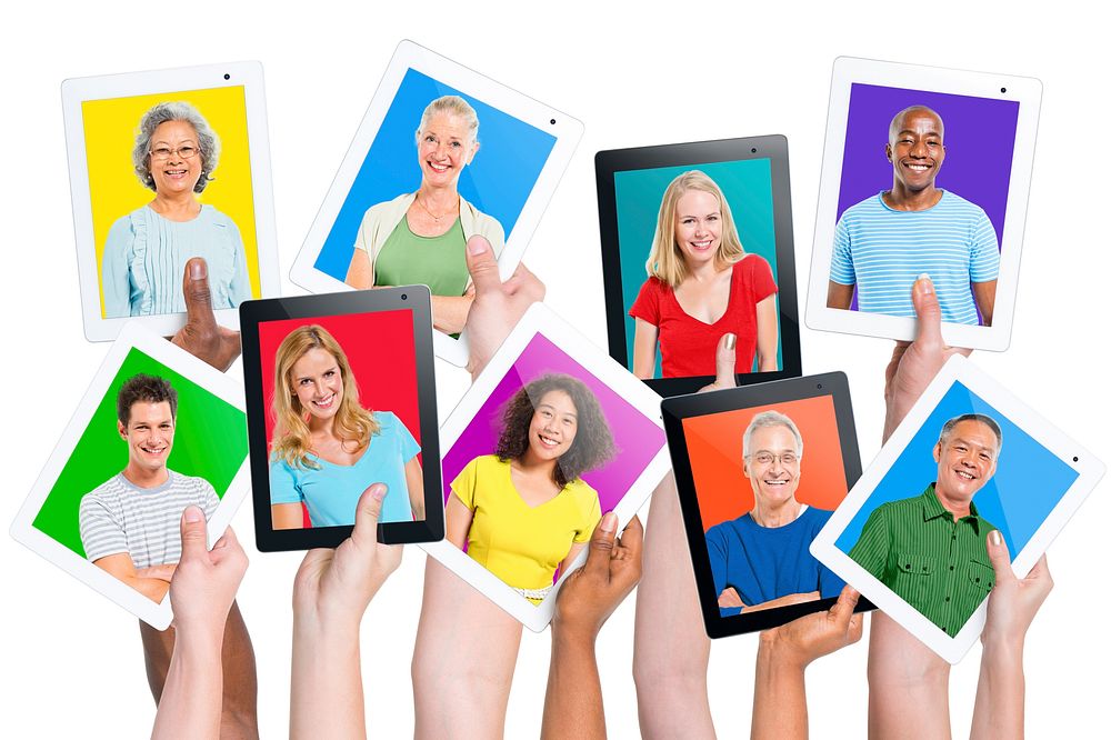 Multi-ethnic casual people holding tablets.