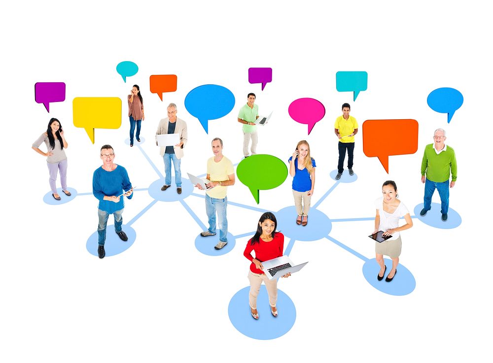 Multi-Ethnic Group Of People Social Networking And Connecting With Colorful Speech Bubbles Above