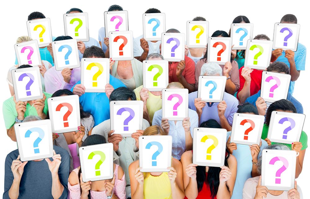 Multi-ethnic group of people holding the talet's question mask screen