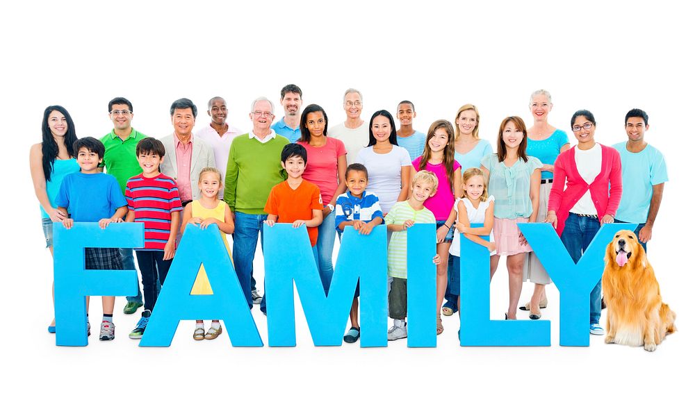 Multi-ethnic group of people holding "FAMILY" letters