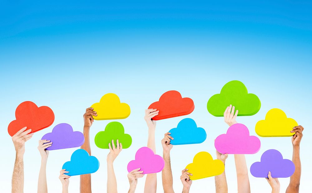 Group of people's hands holding colorful cloud