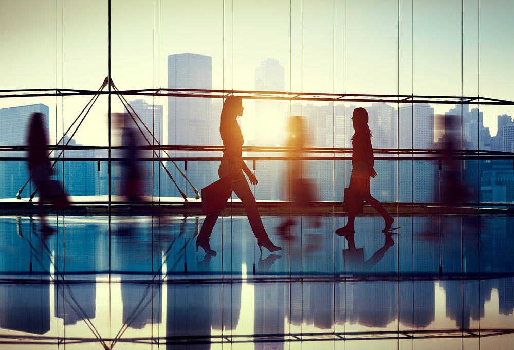 Silhouettes of business people walking