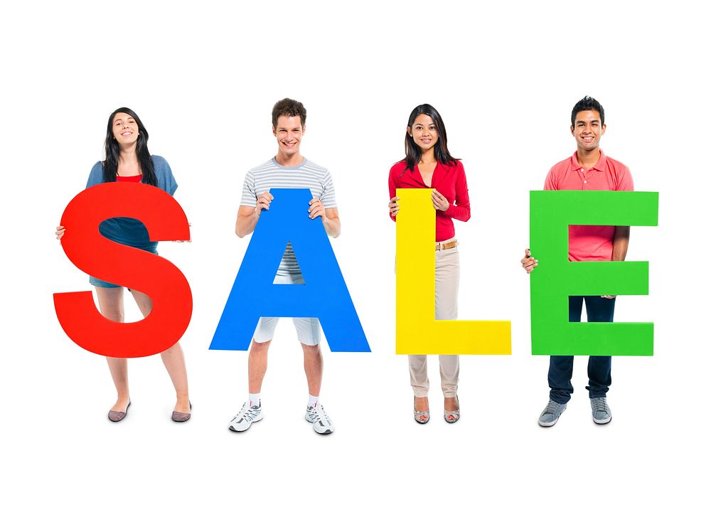 Multi-ethnic group of people holding "SALE" letters