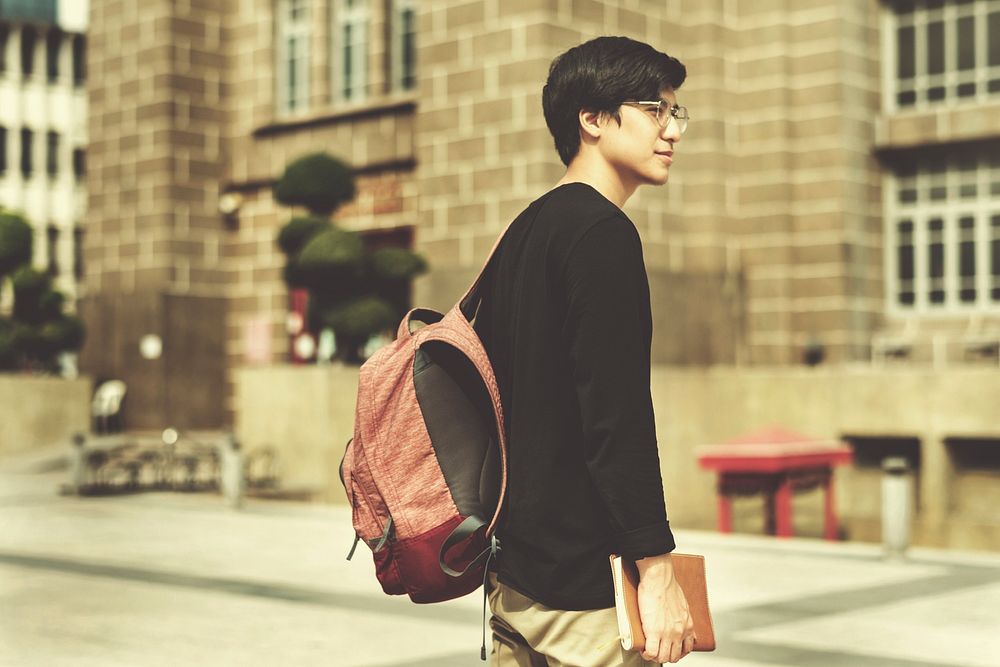 Young asian guy with a backpack