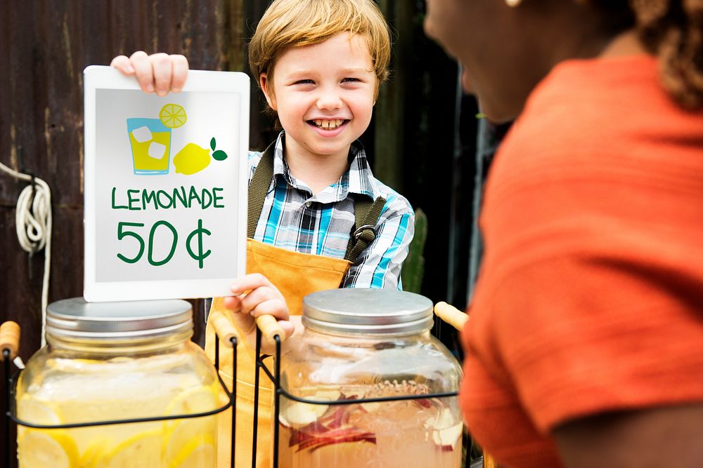 Little Boy Showing Lemonade Price at Food Stall Market