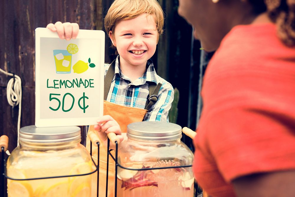 Little Boy Showing Lemonade Price at Food Stall Market