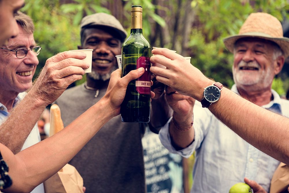 Group of men drinking local red wine together