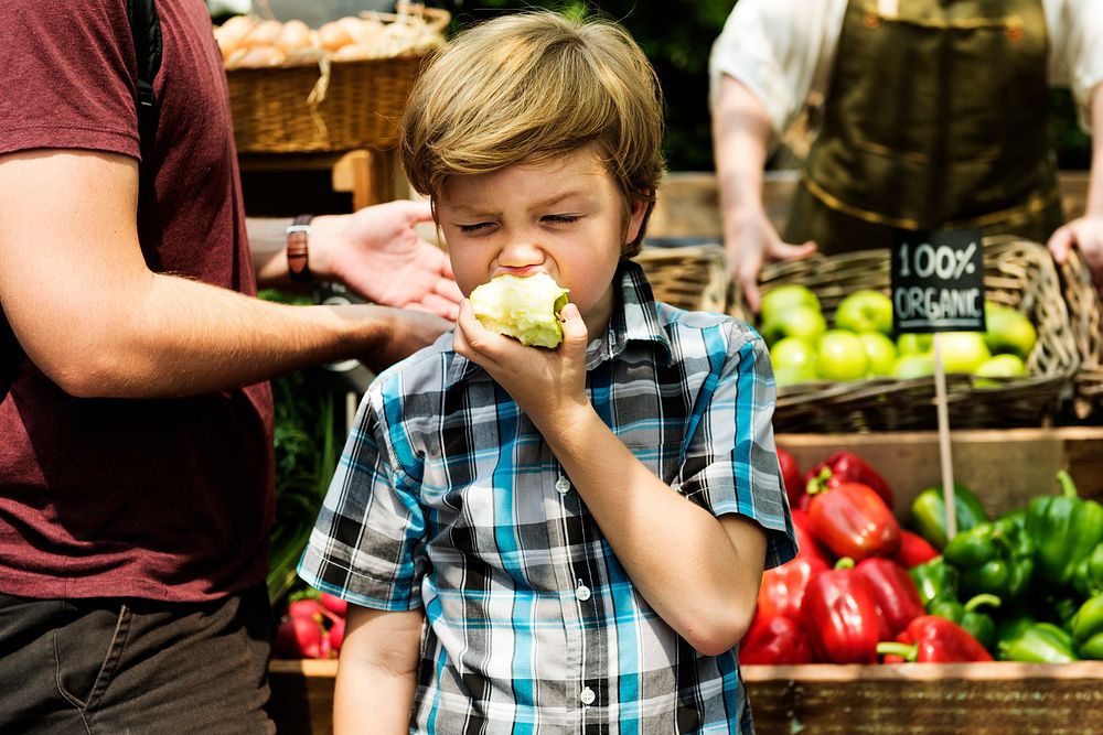 Little Boy Biting Fresh Green Apple