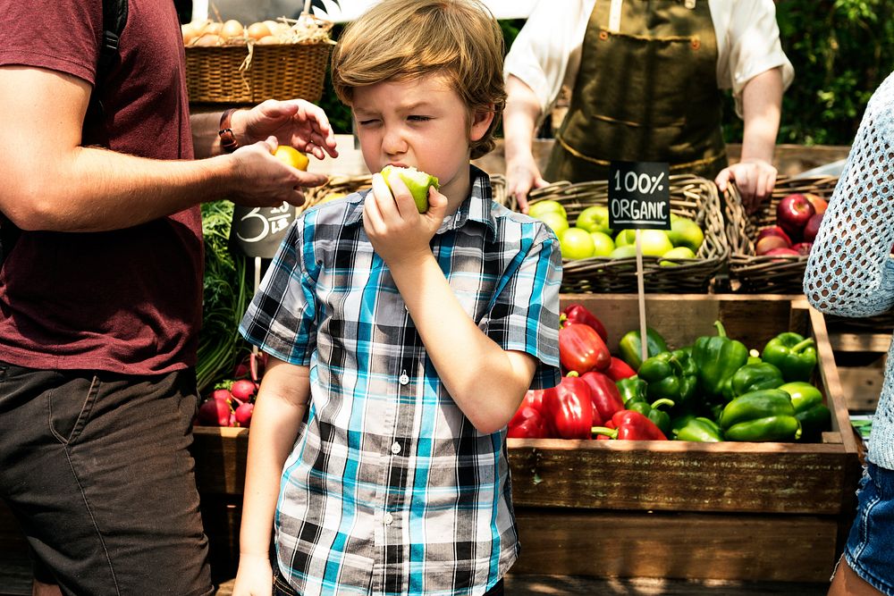 Little Boy Biting Fresh Green Apple