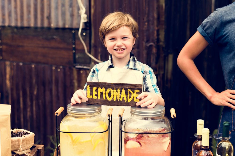 Little Boy Selling Lemonade at Fresh Market