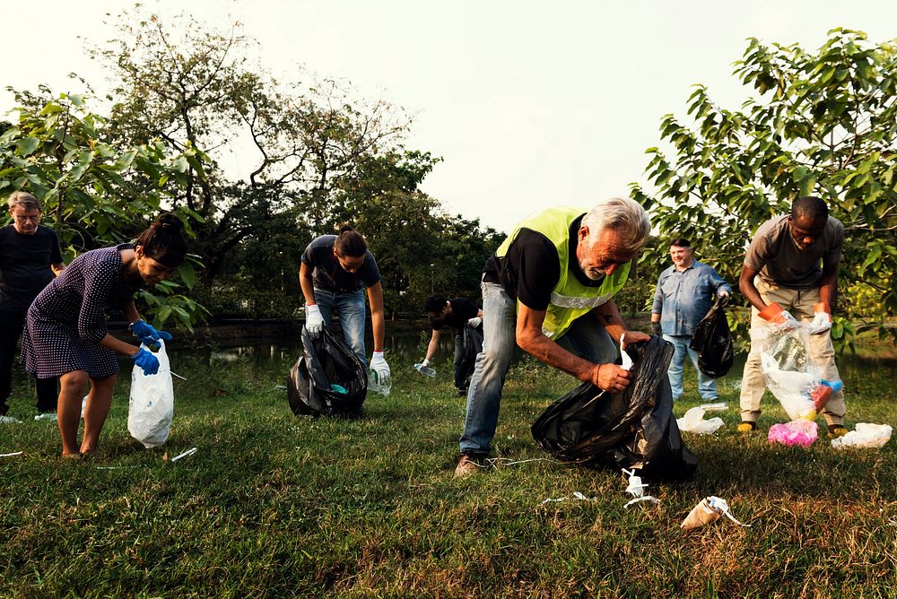 Ecology group of people cleaning the park