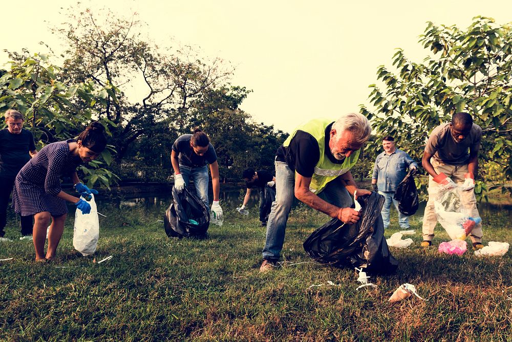 Ecology group of people cleaning the park