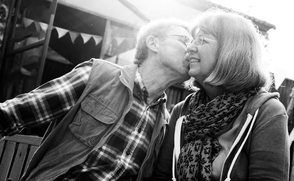 Senior Couple Kissing Other Cheek Love Smitten