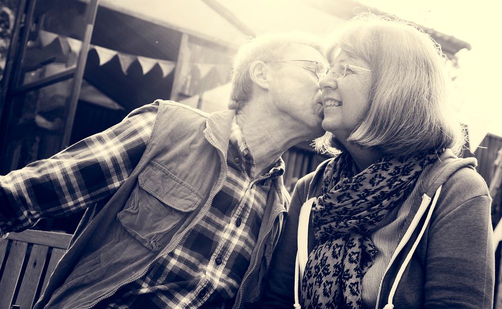 Senior Couple Kissing Other Cheek Love Smitten