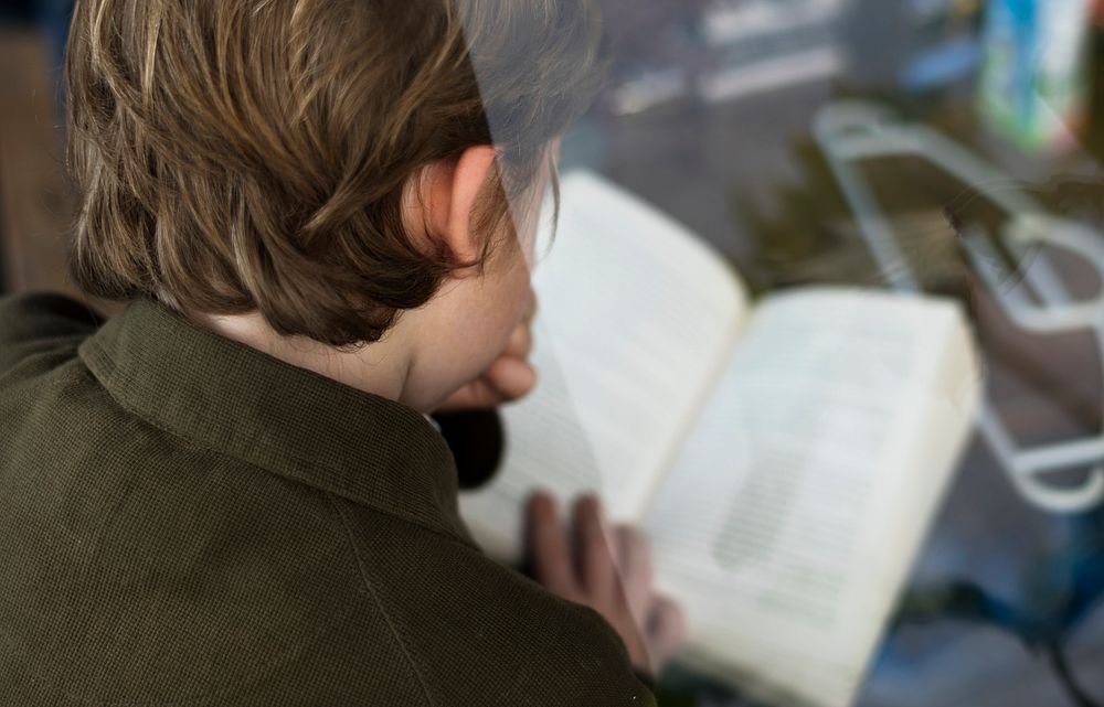 Student is reading a book for a knowledge
