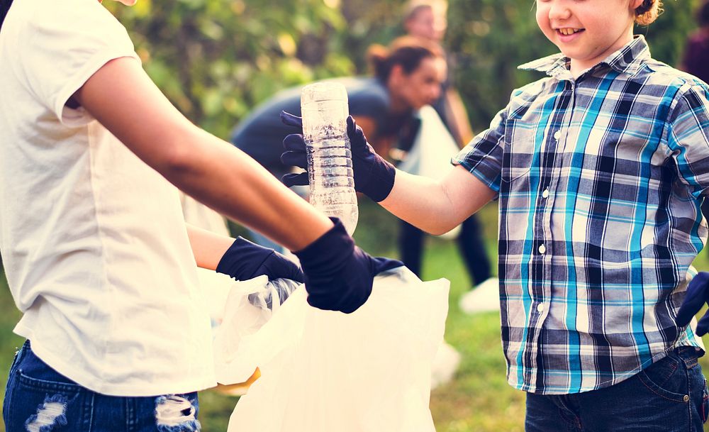 Little Boys Picking Up Plastic Bottle in The Park Volunteer Comm