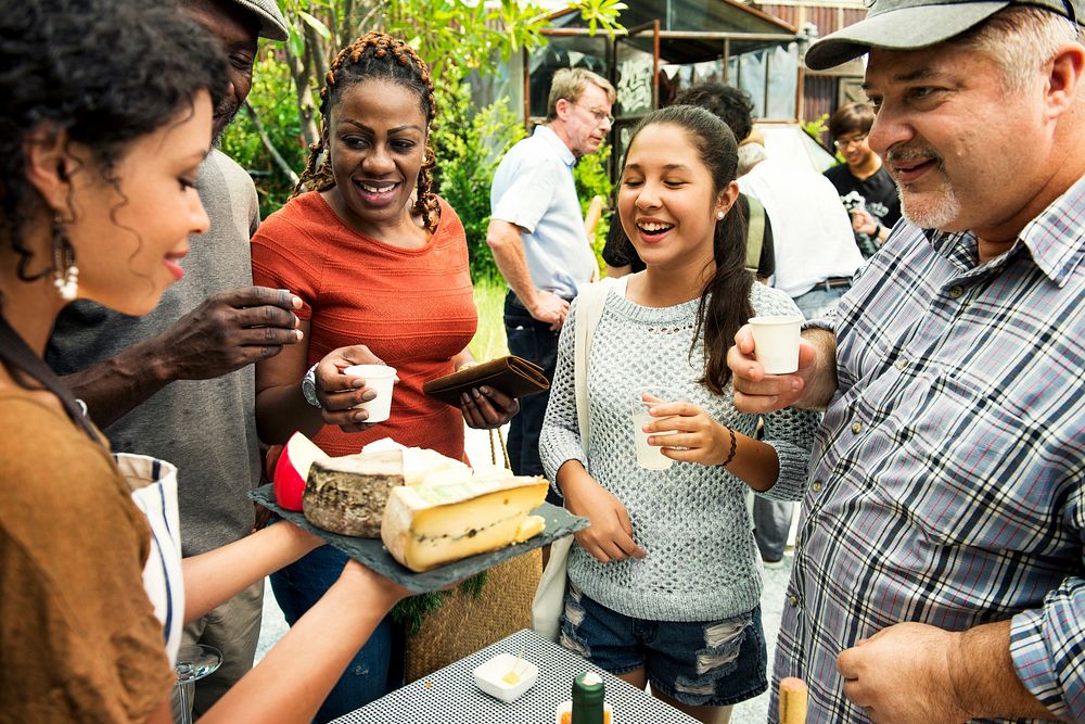 Group of Diverse People Testing Cheese at Food Stall