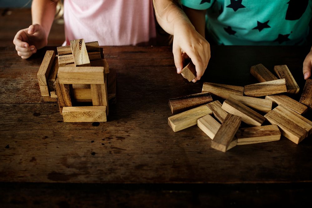 Children Playing Wooden Block Toy with Teacher