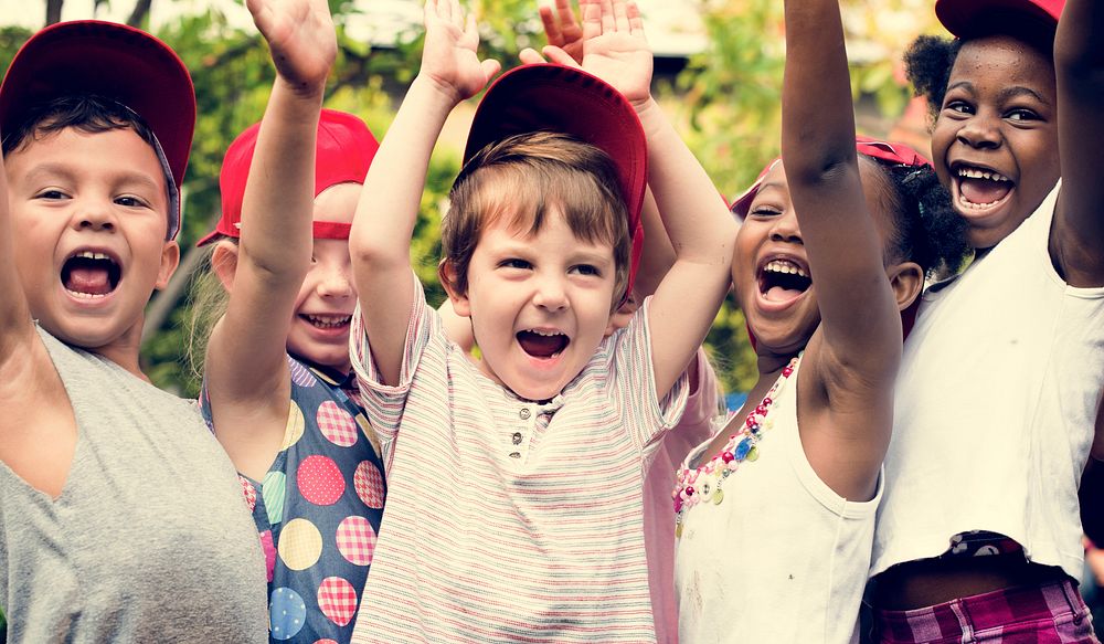 Group of Diverse Kids Hands Raising Up Cheerfully Together