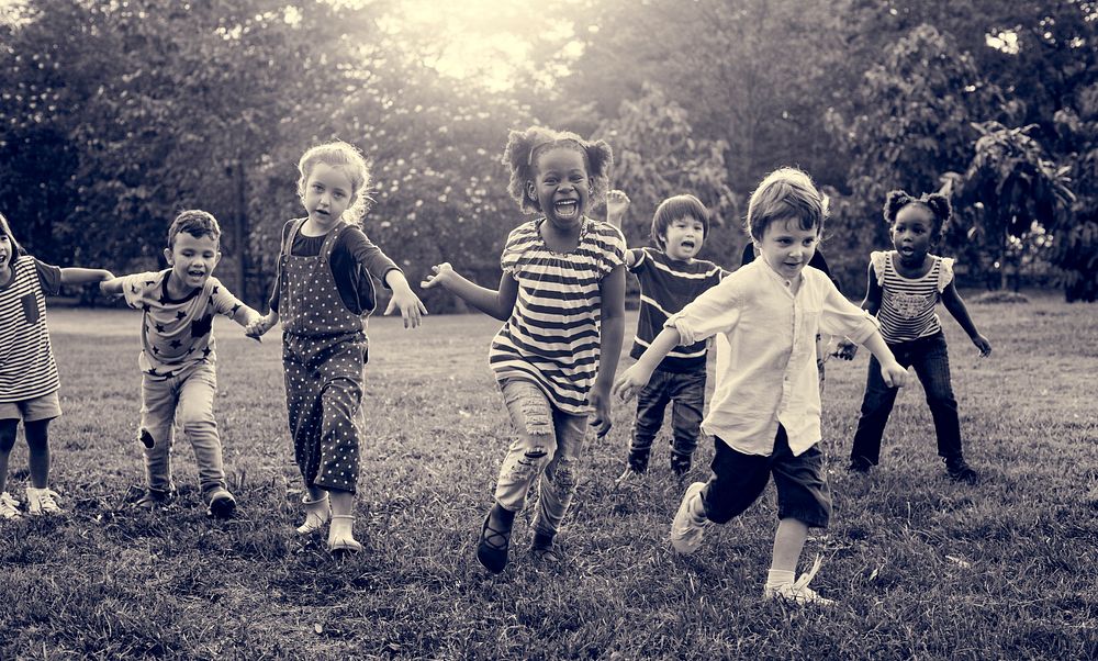 Group of kindergarten kids friends playing playground fun and sm