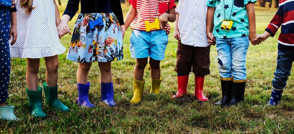 Group of Diverse Kids Holding Hands Together at the Field