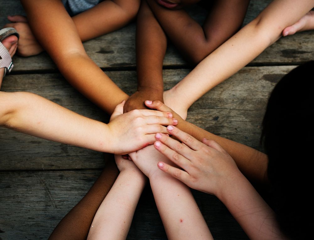 Group of children holding hand assemble togetherness