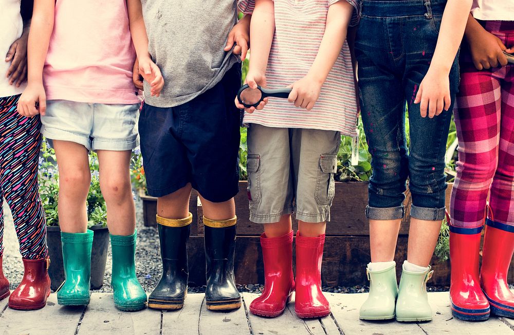 Diversity Group Of Kids Standing Rubber Boots Magnifying Glass