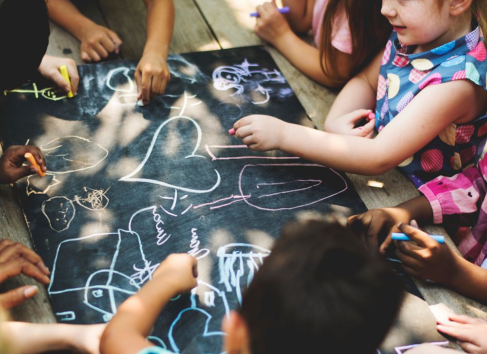 Diverse group of children drawing