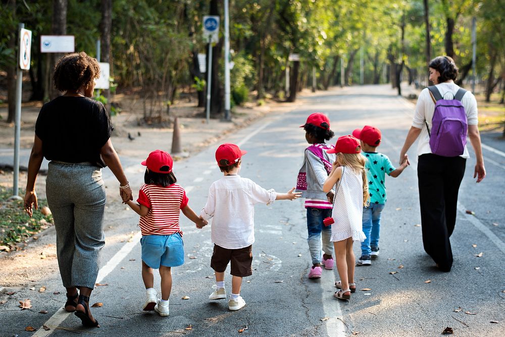 Little Kids with Teacher  Walking Together Field Trip