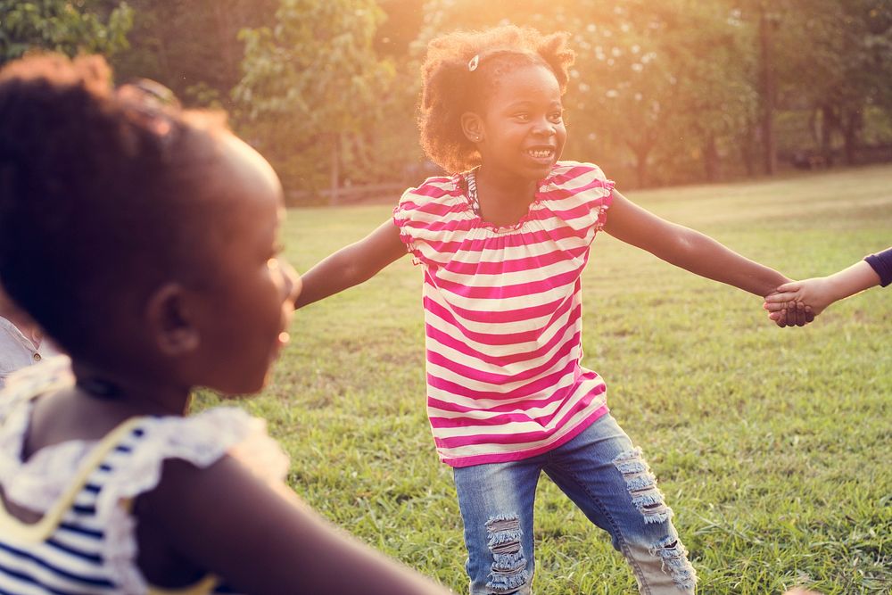 Happiness group of cute and adorable children playing in the par