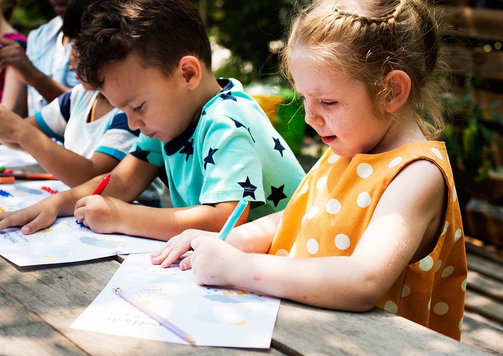 Group of children drawing imagination outdoors
