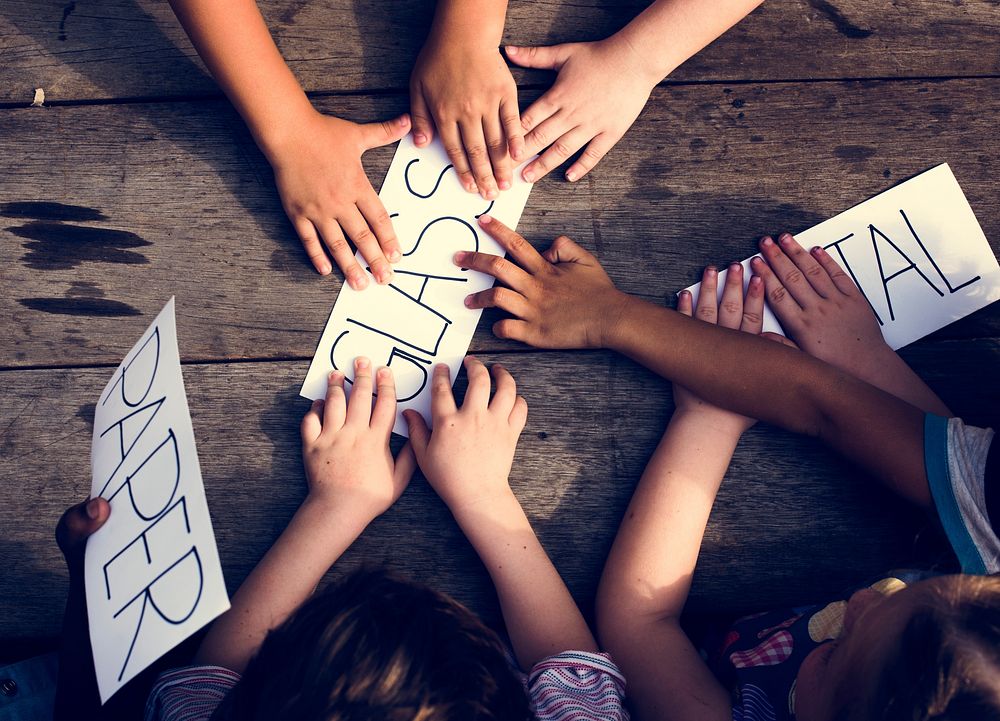 Group of children hand with word of recycle stuff