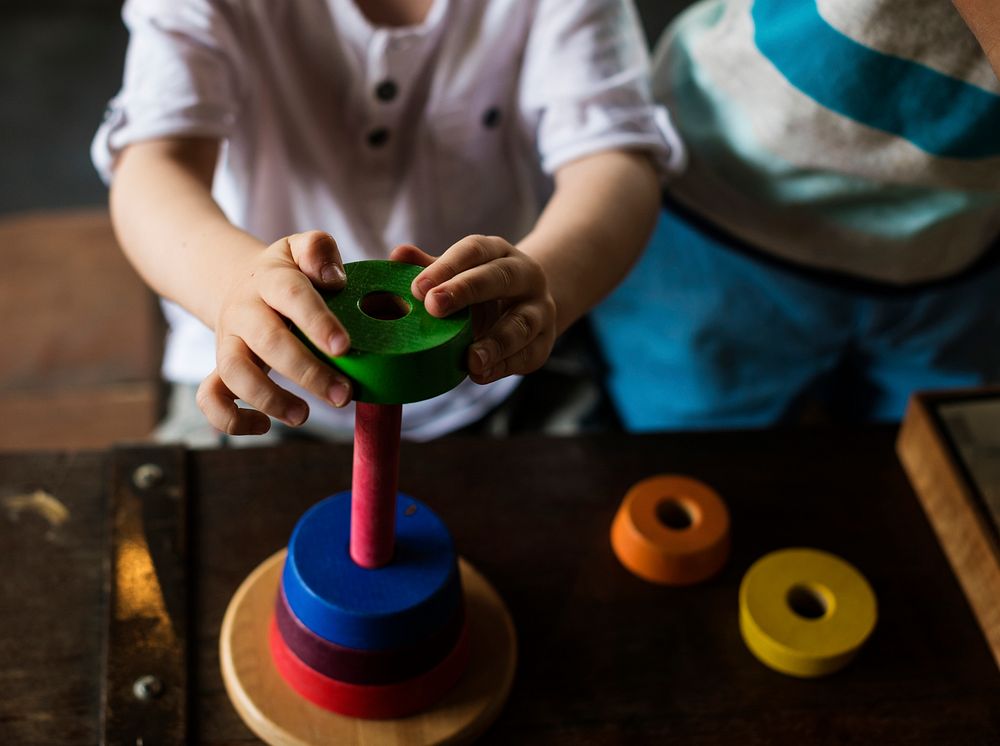 Wooden toy and child playing