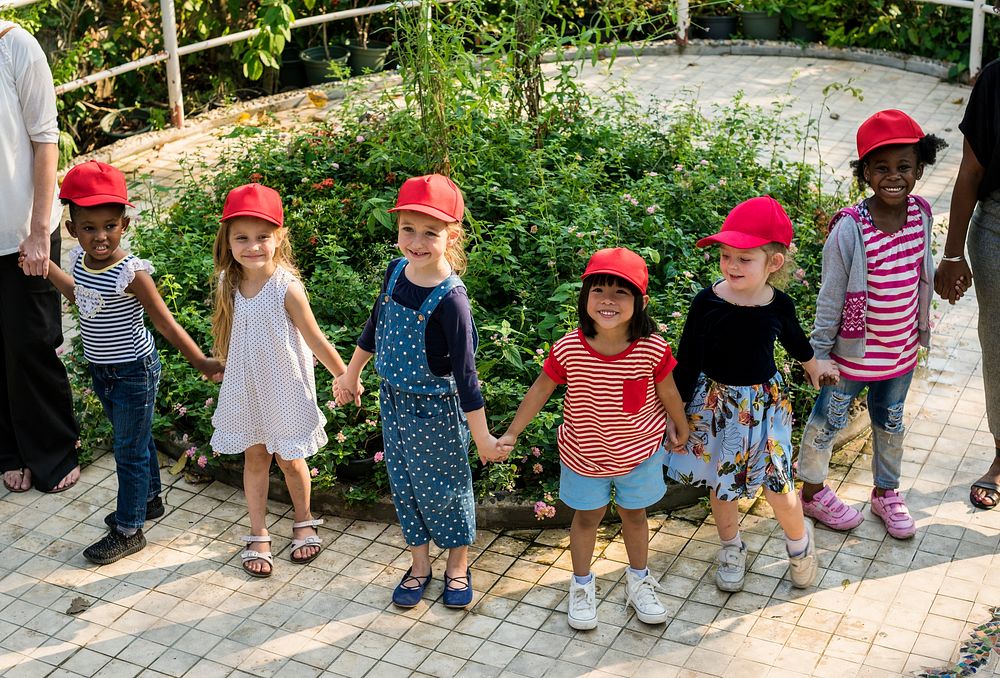 Group of kids school field trips learning outdoors botanic park