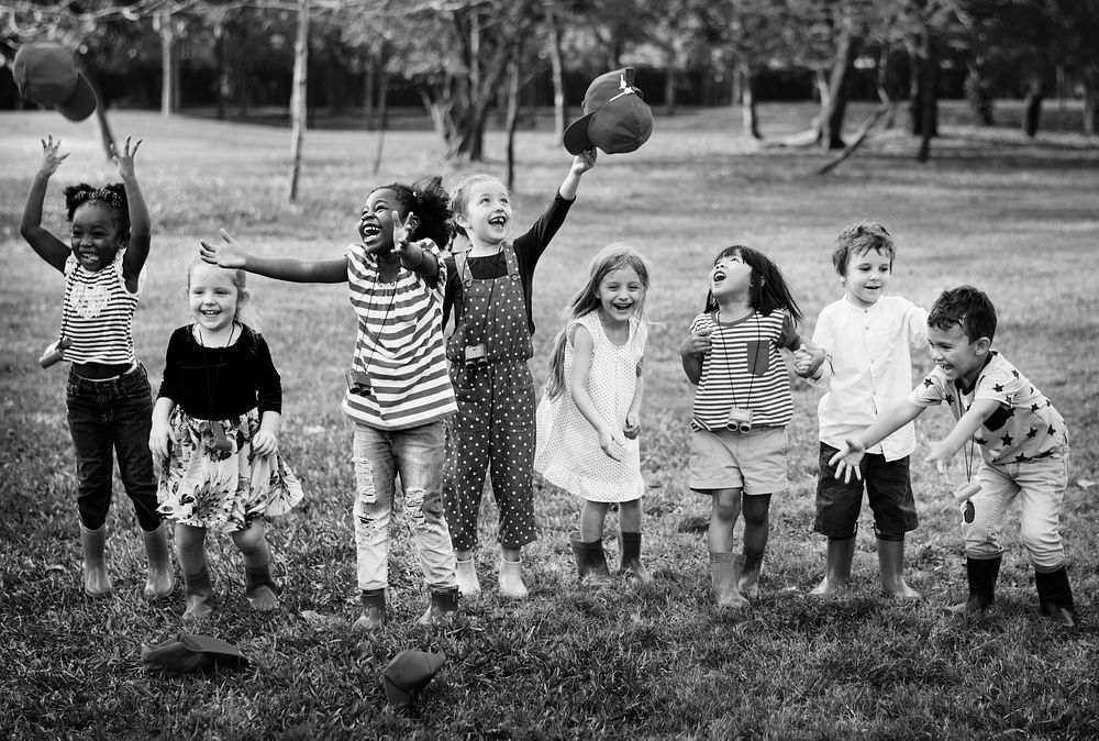 Group of Diverse Kids Playing at the Field Together