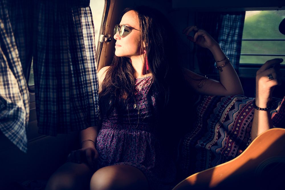Woman Sitting Thoughtful in a Van Roadtrip