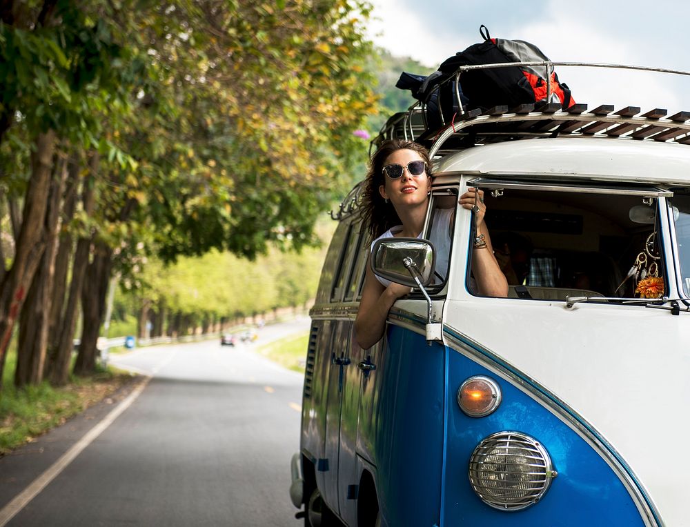 Woman Sitting in a Car Put Head Out of Window