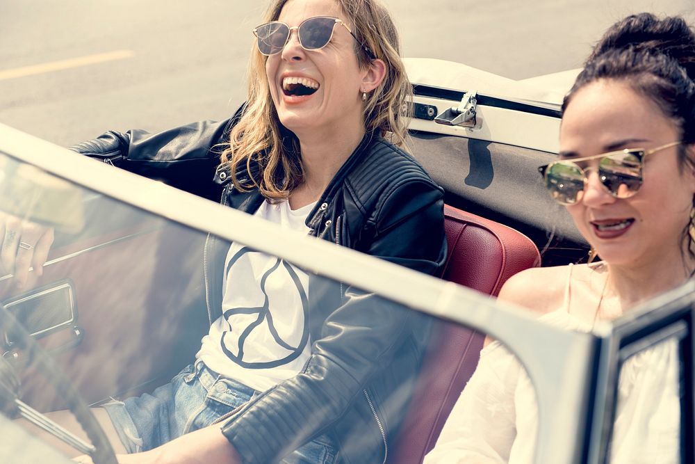 Women Couple Driving a Car Road Trip Together