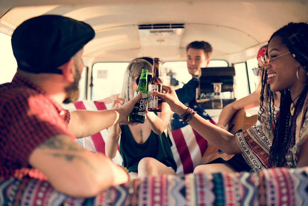 Group of Diverse Friends Drinking Beers Alcohol Together on Road