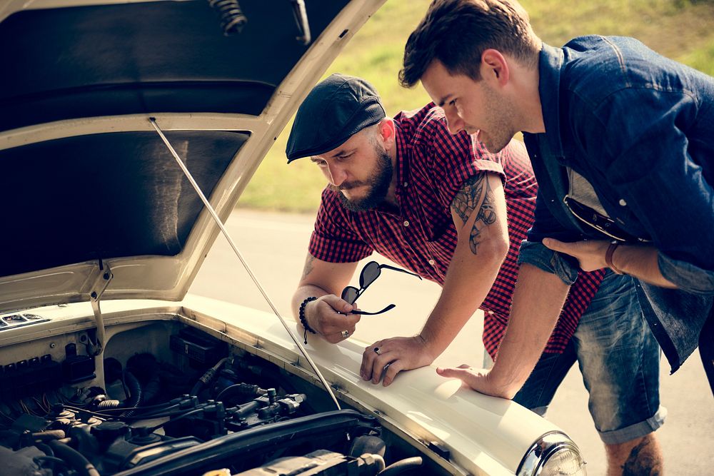 Men Checking Broke Down Car on Street Side with Open Hood