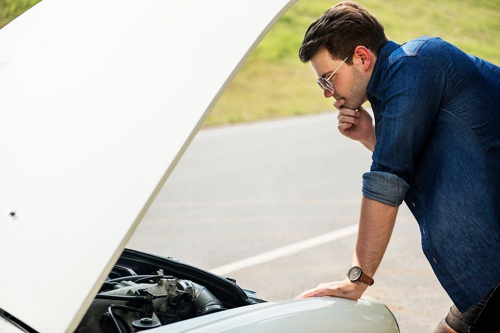 Men Checking Broke Down Car on Street Side with Open Hood