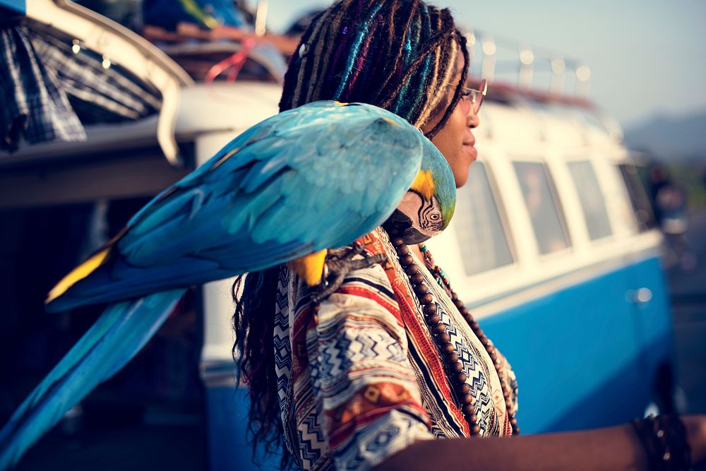 Woman with Parrot on Shoulder Standing by The Van
