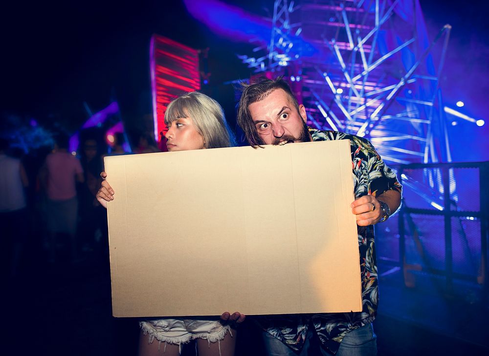 People Holding Blank Empty Design Space Paper Board in Concert