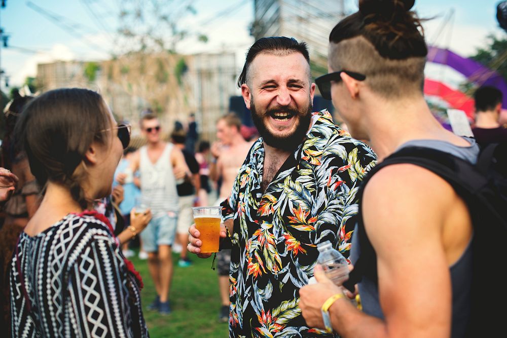Group of Friends Drinking Beers Enjoying Music Festival together