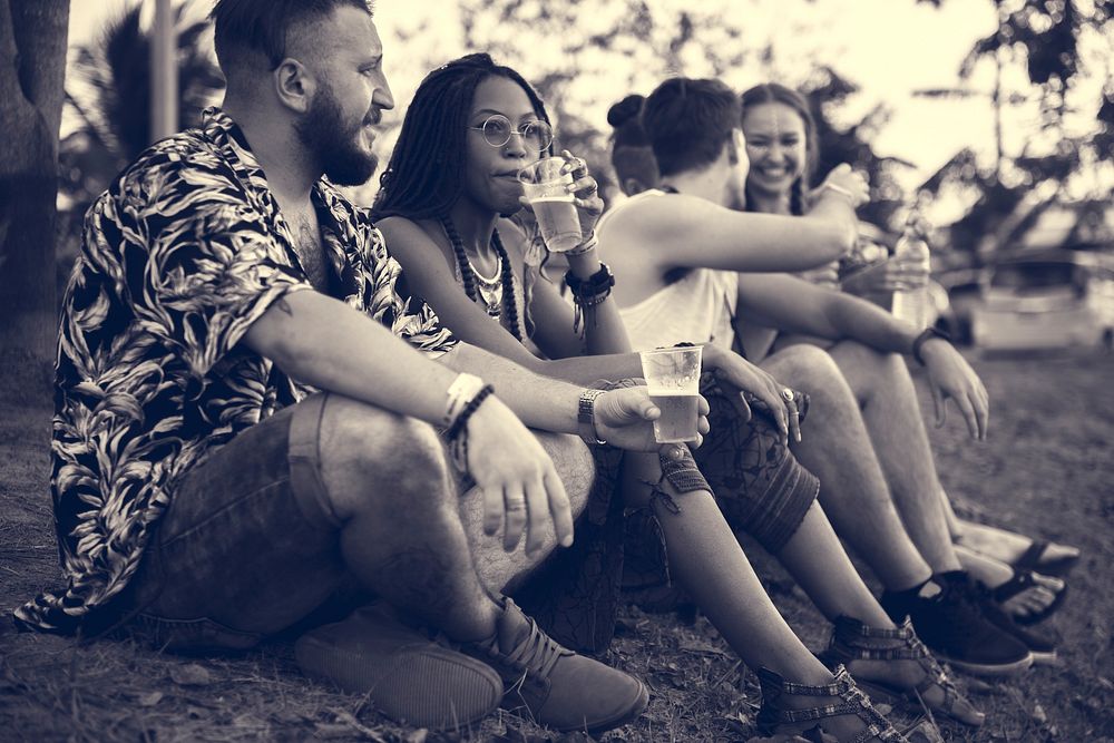 Group of Friends and Beers Enjoying Music Festival Together
