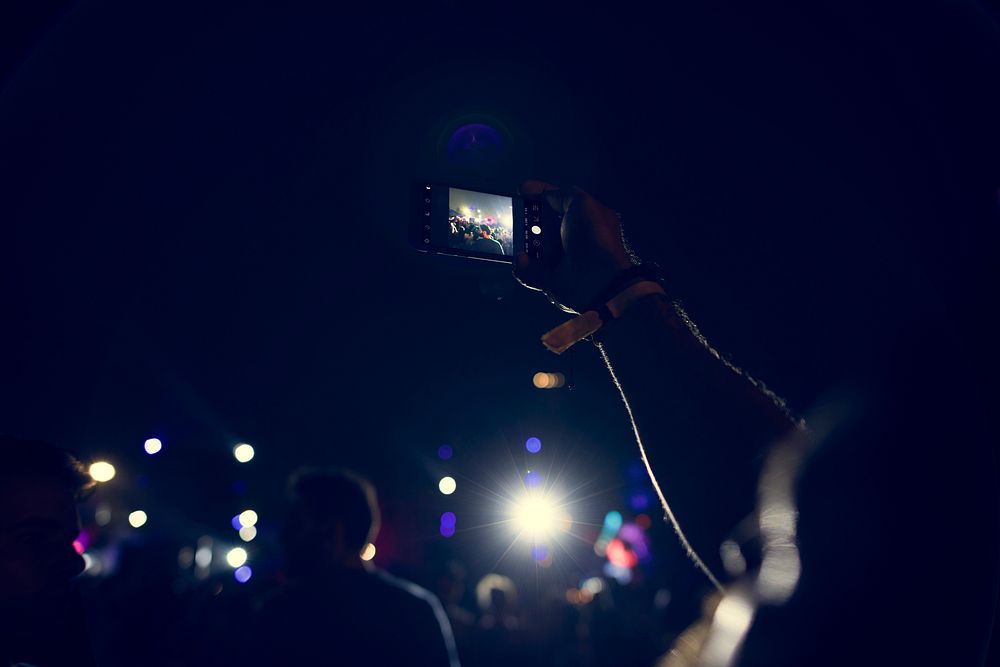 People Taking Photo in Music Concert Festival