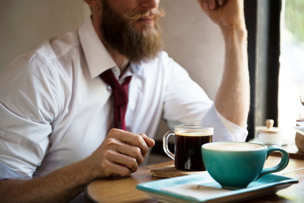 Man chilling out with coffee at cafe