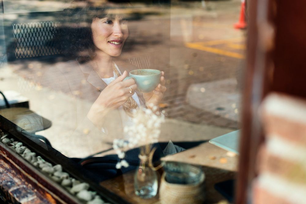 Woman chilling out with coffee at cafe